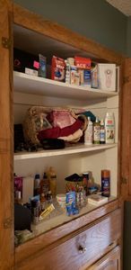lot 239 image: Contents of Cabinet, see Pictures. Includes Mia 2 Electric Facial Cleanser Unopened and Amope Pedi Perfect unopened