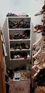 lot 240 image: Contents of Closet, see Pictures. Includes Shoes, Hats, Ladies Clothes, Shoe Racks, Unopened Cosmetic Bag