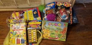 lot 114 image: Unopened  Microsticker Activities, Sponge Paint Kit, Skip-Bo Card Game, Jelly-Belly Dispenser, Virtual Pet Wrist Watch, Lap Harp