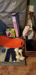 lot 117 image: Billie Jean King Wilson Racket, Wilson Performer Racket, Simply Fit Board, Back Support Belt, Exercise Mat, Yoga Mat Unopened, 75 cm Stay Ball, and Weights