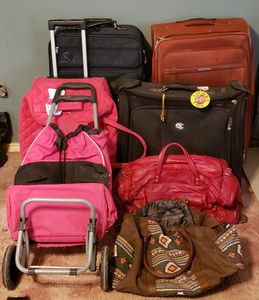 lot 118 image: Olympia Rolling Luggage Bag, Blue Rolling Luggage Bag,  Rolling Duffle Bags and More, see pictures
