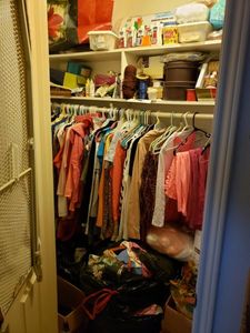 lot 121 image: Contents of Closet Included Ladies Clothes, Shoes, Large amount of Crafts and Books