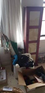 lot 128 image: 4 ft. Storage Cabinet with Picture Frames on Front, Umbrellas, Gloves, Faux Fur Items
