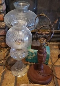 lot 79 image: Metal Sundial, Electric Clear Glass Hurricane Lamp, Electric Clear Hobnail Glass Top and Metal Base with Handle Lamp and Vintage Wooden Base Lamp