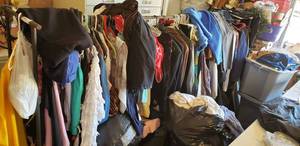lot 318 image: Large Lot of Clothes and Clothing Rack