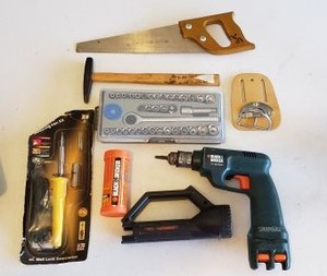 lot 332 image: Small Tools Set Black & Decker Drill Needs Batteries, Soldering Kit, Small Ratchet Set, Tack Hammer, and Hand Saw