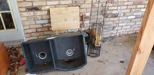 lot 352 image: Kitchen Sink with Disposal 31Wide, Wire FruitVegetable Rack, Wire CD Rack, Wooden TV Tray and More as shown