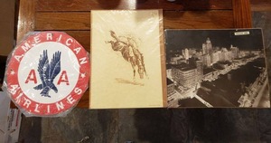 lot 272 image: Picture of Dallas from 1939, Ltd. Edition Print of Cowboy Riding Bronco by Stewart, Metal American Airlines Round Sign