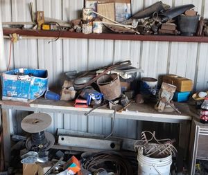 lot 379 image: Shelf and Table Contents Includes large amount automotive parts, metal, wire and Outdoor items (NOT INCLUDED ARE Vise and Ryobi Battery Operated WHICH ARE IN SEPARATE LOTS)