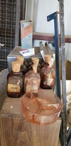lot 397 image: Pink Glass Ash Tray, Set of Vintage Brown Spice Bottles (need new corks), Vintage Peacocks Bromides in Original Box (FOR DISPLAY ONLY)