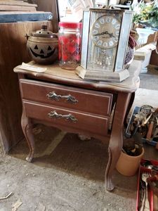 lot 505 image: Mid Century Side Table and Contents Includes Golden Hexagon Spin Clock, Sound of Music Mirrored Music Box, Wicker Ducks