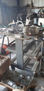 lot 521 image: Rolling 3 Shelf Cart, Small Table with Re-Bar Legs, Cattle Prod and More
