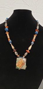 lot 742 image: Sterling silver artisan crafted mixed medium necklace with jasper, wood, glass and other beads. Marked MEG Sterling. 22L