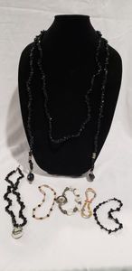 lot 744 image: Black onyx necklaces and bracelets and Howlite watch. 7 ct. (one is a lariat)