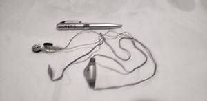 lot 746 image: Quasar vintage FM radio pen with wired earbuds.