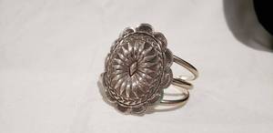 lot 752 image: Large sterling concho bangle bracelet. Marked sterling on frame and concho.