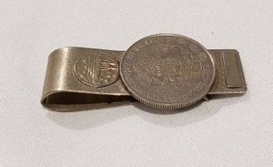 lot 756 image: Alpaca Mexico money clip with coin front. Marked alpaca Mexico