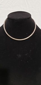 lot 764 image: Sterling silver Omega choker. Marked .925 near tip.