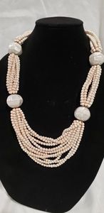 lot 769 image: Ceramic bead necklace with Mother Of Pearl covered large spacer beads. 24L approx. Has a replaced oversized o-ring clasp.