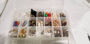 lot 779 image: Plastic organizer with earrings (all pairs). Approx 38 count.  Includes organizer