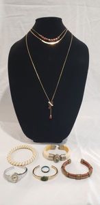 lot 694 image: Fashion jewelry including 2 pieces of signed Park Lane necklaces, a leather & brass cuff bangle and India bone bangle bracelet with sodalite stone (missing pin for clasp)