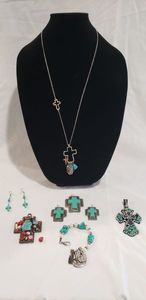 lot 702 image: Faux turquoise fashion selection. Includes 2 crosses, necklace with cross motif, Dangle pendant and earring suite and cross earrings