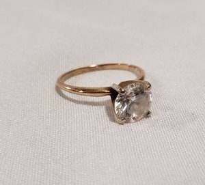 lot 631 image: Engagement ring with clear stone, stamped 14K, Size 6.5 Stone abraided