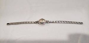 lot 699 image: Benrus watch. Marked 14K Gold on reverse with after market Speidel 10K gold filled watch band (no clasp)