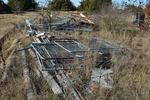 lot 686 image: Scrap Metal Pile chain link fencing and gates, Large reel of 2 inch water line,