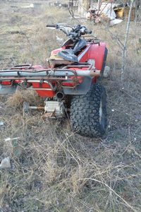 lot 545 image: Old Honda TRX 200 ATV motor parts are in lot 379