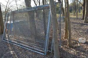 lot 562 image: Kennel Sections, Gates, Piping Barrels for houses, water dishes, and water line