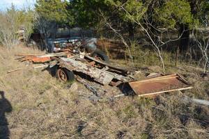 lot 554 image: Misc scrap metal shelving trailer frame yard tractor and truck topper.