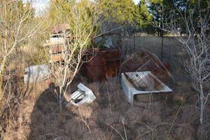 lot 557 image: Misc scrap cast iron cages, barrels, dog trailer and more