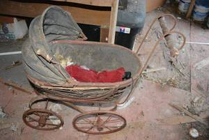 lot 608 image: Vintage Doll Stroller early 1900s wicker and metal stroller. And antique doll