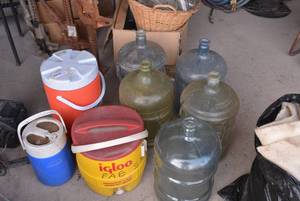 lot 539 image: Coleman and Igloo water coolers and 5 gal water jugs