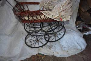 lot 609 image: Vintage Doll Stroller early 1900s wicker and metal stroller.