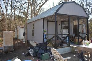 lot 618 image: Tiny house shed, 30x 12 Barn Style shed finished inside with bathroom bedroom and kitchenette area. Items inside are not included. PICK UP NEEDS TO BE BETWEEN FEB. 24 AND 28TH.