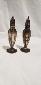 lot 799 image: Salt and Pepper Shakers Stamped Sterling CementLoaded W with an Arrow through it
