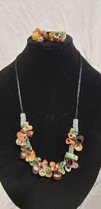 lot 655 image: Artisan crafted kiln fired pottery mini beer mug  grog necklace. 26L and matching earrings