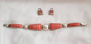 lot 739 image: Sterling silver vintage artisan crafted hinged bracelet with inset coral. Marked Magbe 925. Push button clasp, 7.5L and Pair of Earrings are close match Marked with Makers Mark Silver World 925 Mexico