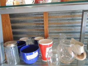 lot 25 image: Glassware- mugs, mason jars, gravy boat and vase