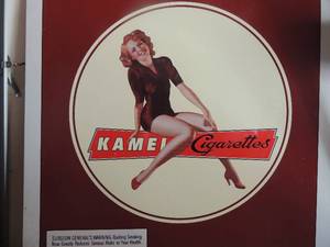 lot 53 image: Kamel Cigarettes metal sign 24x24