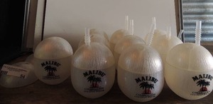 lot 54 image: Plastic Malibu Rum coconut cups 7 with lids and straws2 without straws plus 2 extra lids