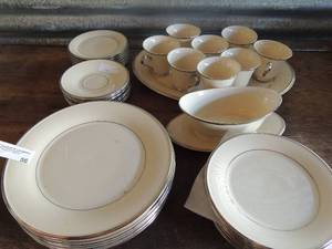 lot 56 image: Lenox solitaire dishes made in USA gray boat and platter, 7 dinner plates, 8 cup and saucers, 8 saucers, 8 salad plates 1 large platter 41 total pieces
