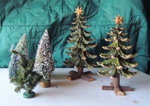 lot 68 image: 4 six inch xmas trees, 2 eight inch trees on log stand needs repair