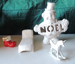 lot 67 image: Ceramic and wicker sleigh chair, white ceramic snowman says Noel Santa bowl 2 rocking horse