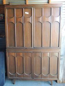 lot 113 image: 2 piece entertainment center double doors on the  top and bottom  has 2 drawers needs some work but ok. 68 x 44
