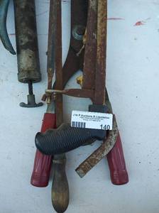lot 140 image: Assorted hacksaws, saws grease guns, hedge trimmers