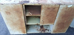 lot 180 image: Metall cabinet  with shelves  & doors,  one door needs TLC . 30tall x 54long x13 deep