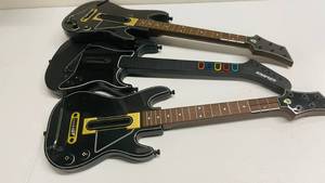 lot 26 image: 3 Guitar Hero Guitars
